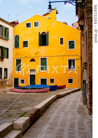 yellow house and inner court with boats in Venice yellow house and inner court with boats in Venice 69351996
