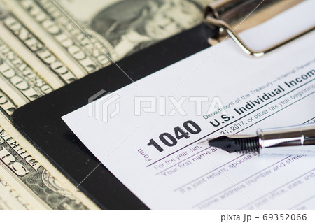 individual income tax return form 1040 with dollars banknotes ba individual income tax return form 1040 with dollars banknotes ba 69352066