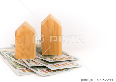 wooden house model with dollars banknotes, realty expensive cost concept 69352244