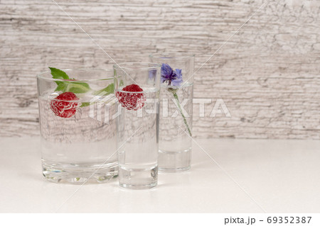 refreshment or detox water with mint and raspberry in high glass refreshment or detox water with mint and raspberry in high glass 69352387