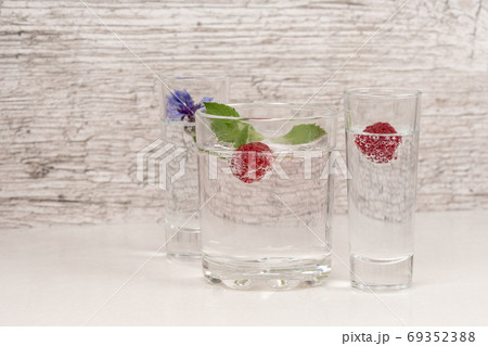 refreshment or detox water with mint and raspberry in high glass refreshment or detox water with mint and raspberry in high glass 69352388