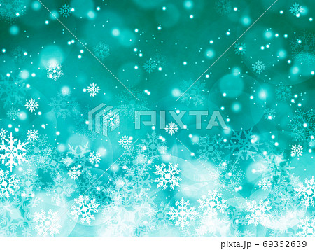 雪と結晶がキラキラ輝き降り積もる背景イラスト 緑のイラスト素材