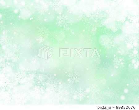 雪と結晶がキラキラ輝き降り積もる背景イラスト 薄緑のイラスト素材