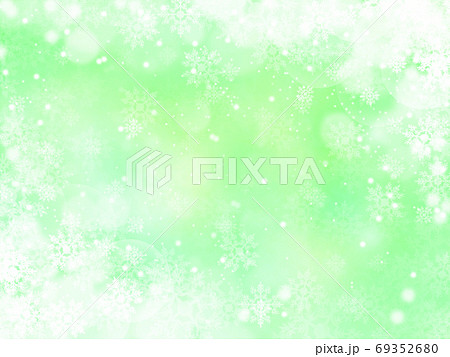 雪と結晶がキラキラ輝き降り積もる背景イラスト 黄緑のイラスト素材