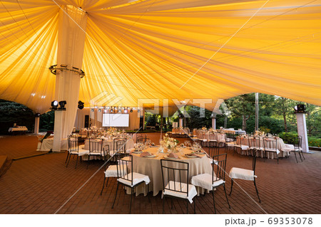 tables in outdoor tent day. Wedding decor. tables in outdoor tent day. Wedding decor. 69353078