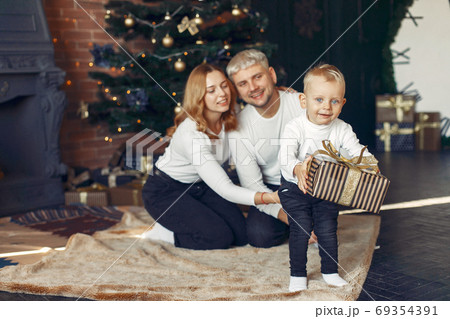 Family with little son at home near christmas tree 69354391