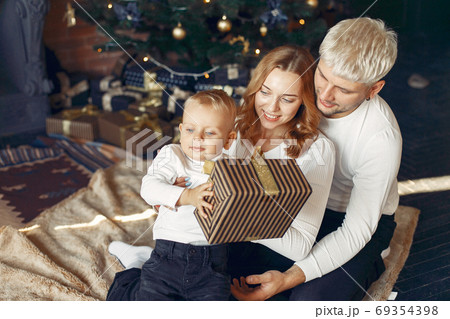 Family with little son at home near christmas tree 69354398