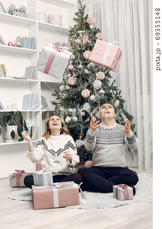Couple spend time at home with christmas decorations 69355148