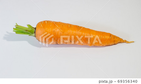 Large, fresh carrot isolated on a white background Large, fresh carrot isolated on a white background 69356340