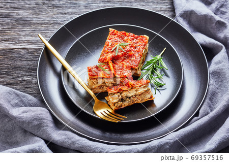 Vegan tofu spinach lasagna on a black plate 69357516