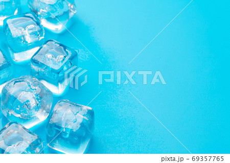 Ice cubes and water drops 69357765