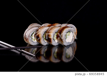 Fresh delicious beautiful sushi rolls on a dark background 69358945