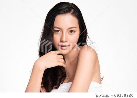 Beautiful young asian woman with clean fresh skin on white background, Face care, Facial treatment Beautiful young asian woman with clean fresh skin on white background, Face care, Facial treatment 69359330