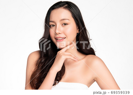 Beautiful young asian woman with clean fresh skin on white background, Face care, Facial treatment Beautiful young asian woman with clean fresh skin on white background, Face care, Facial treatment 69359339