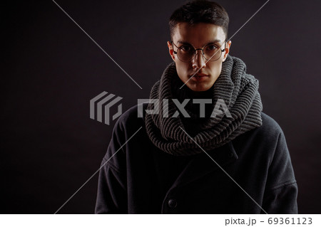 Portrait of handsome stylish man in coat with watch 69361123