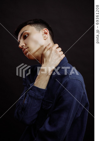 Close up Of Young Man On Black Background 69361208