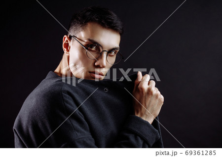closeup portrait of handsome caucasian brunette on black closeup portrait of handsome caucasian brunette on black 69361285