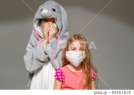 kids in pajamas and masks in quarantine epidemic 69361819