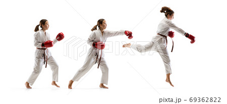 Confident junior in kimono practicing taekwondo combat, martial arts 69362822