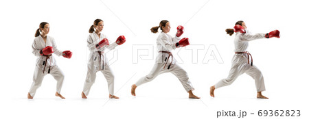 Confident junior in kimono practicing taekwondo combat, martial arts Confident junior in kimono practicing taekwondo combat, martial arts 69362823