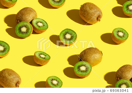 Kiwi fruits pattern on yellow background 69363041