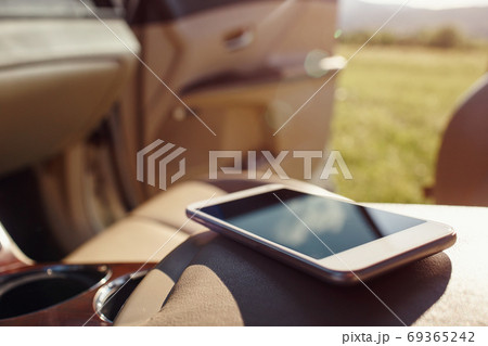 smart phone phone on the car seat dashboard 69365242