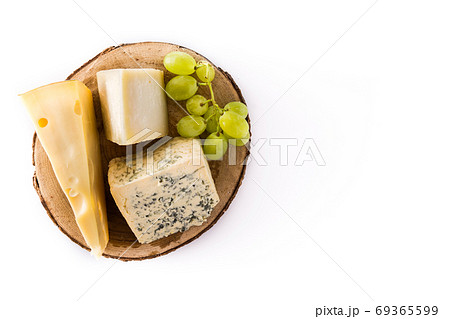 Different types of cheeses and green grapes isolated on white background	 69365599