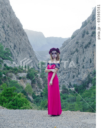 Halloween makeup woman of Santa Muerte outdoors Halloween makeup woman of Santa Muerte outdoors 69366581