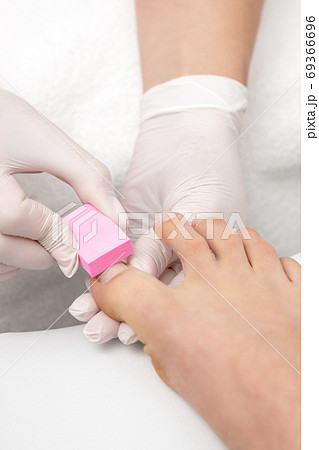 Close up of woman receiving pedicure 69366696