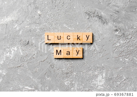 lucky May word written on wood block. Happy May text on table, concept 69367881