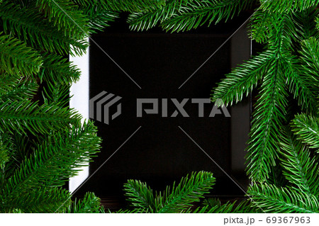 Top view served plate with green fir tree branches. Holiday dinner concept with copy space 69367963