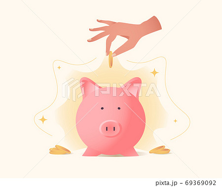 Female hand holds coin and drops it into the piggy bank 69369092