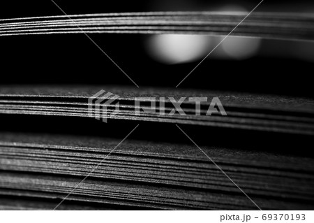 Black paper sheets with selective focus, close-up. Abstract blac Black paper sheets with selective focus, close-up. Abstract blac 69370193