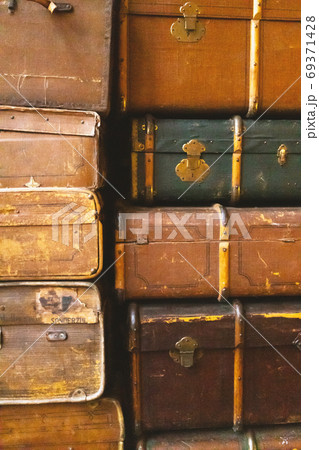 Old antique suitcases, close-up. Vintage retro styled texture. V 69371428