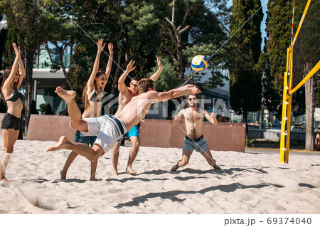 Beach volleyball players amateurs in action Beach volleyball players amateurs in action 69374040