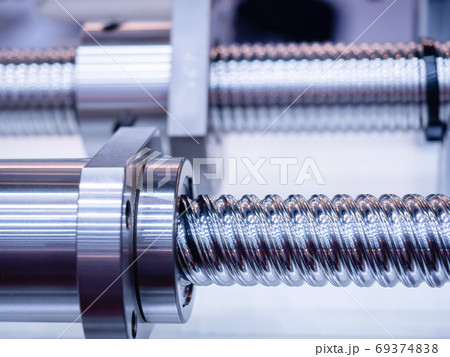 Steel rod with a screw thread and a metal round detail, in industrial applications.close-up. Steel rod with a screw thread and a metal round detail, in industrial applications.close-up. 69374838