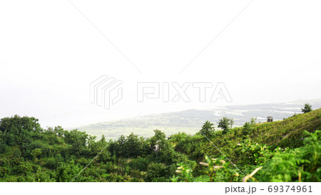 Green glade in a mountain valley Green glade in a mountain valley 69374961