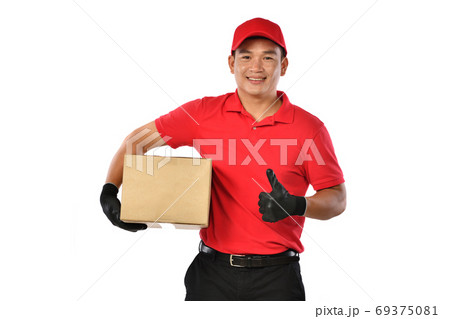 Asian delivery man in red uniform with parcel cardboard box isolated on white background Asian delivery man in red uniform with parcel cardboard box isolated on white background 69375081