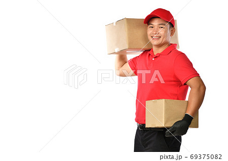 Asian delivery man in red uniform with parcel cardboard box isolated on white background 69375082