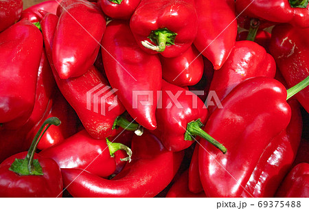 Pile of sweet red peppers, large plani, selective focus. 69375488