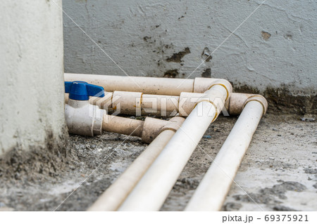 White water pipes with blue faucet, stock photo 69375921