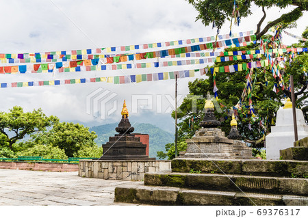 Three stupas and Colorful Worship Flags in Kathmandu city 69376317