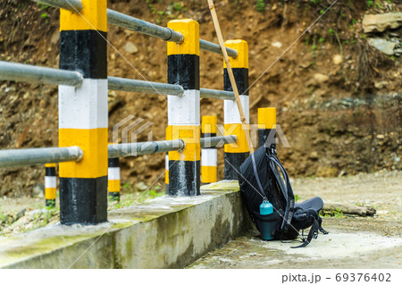 Backpack on car bridge in mountains, stock photo 69376402