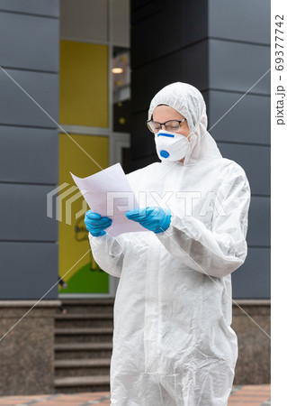 Portrait of tired exhausted female doctor, 69377742