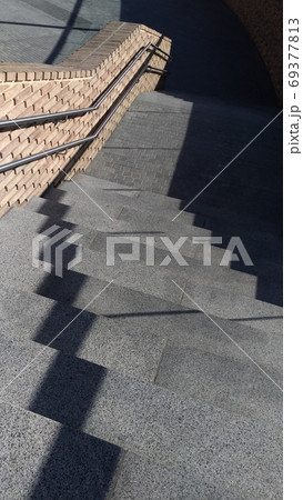 Fragment of stairs with shadows and sunny areas 69377813
