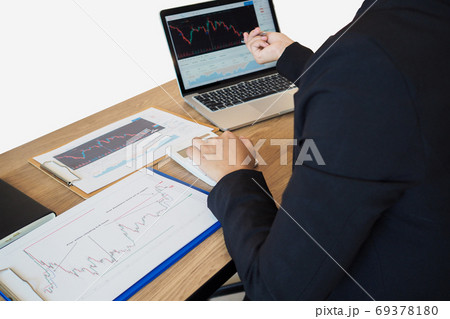 Business trader woman analyze stock graph and report, set targets for online trading management Business trader woman analyze stock graph and report, set targets for online trading management 69378180