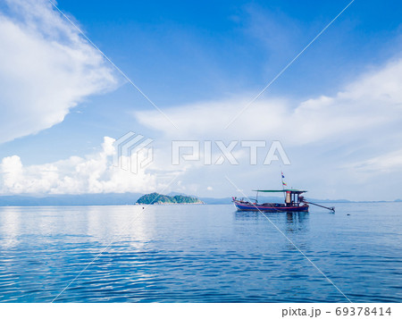 long-tailed boat in Blue sea and sky with white clouds at beauty day light 69378414
