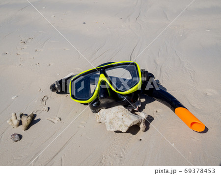 Snorkel on white sand beach background, Enjoy snorkeling Tour on your holidays 69378453