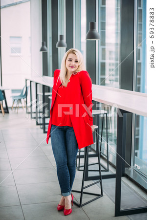 Attractive successful business lady in a red suit 69378883