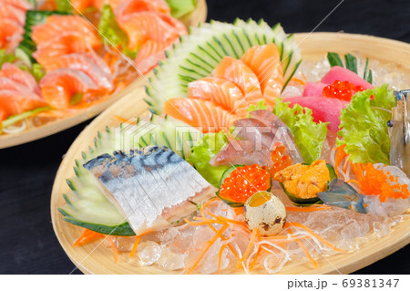 Mixed sashimi - japanese food style on black background Mixed sashimi - japanese food style on black background 69381347